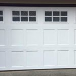 A Closed White Garage Door with a Glass Window