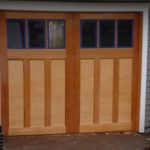 A wooden carriage house door